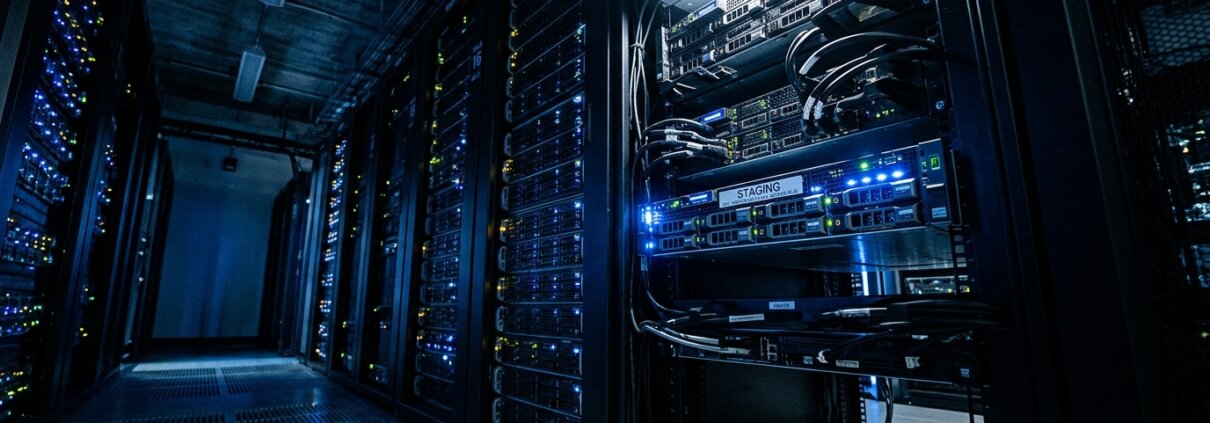 Blue lit server room highlighting a staging blade, illustrating security risks in logistics staging environments.